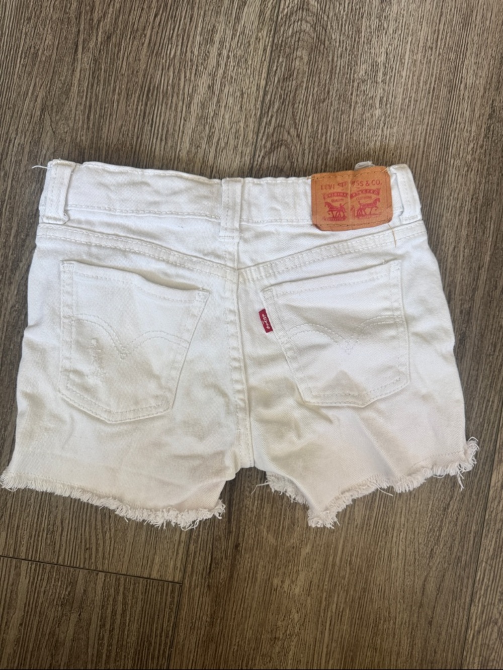 Levi's White Denim Frayed Hem Cutoff Shorts